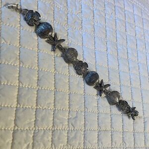 Solid Sterling Sea Life Bracelet - Fearuring Starfish, Shells, & Sanddollars.
